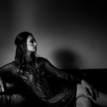 BW photo of woman on couch