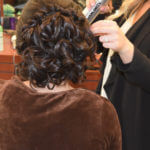 Brunette getting hair styled