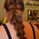 Long braid on bare back